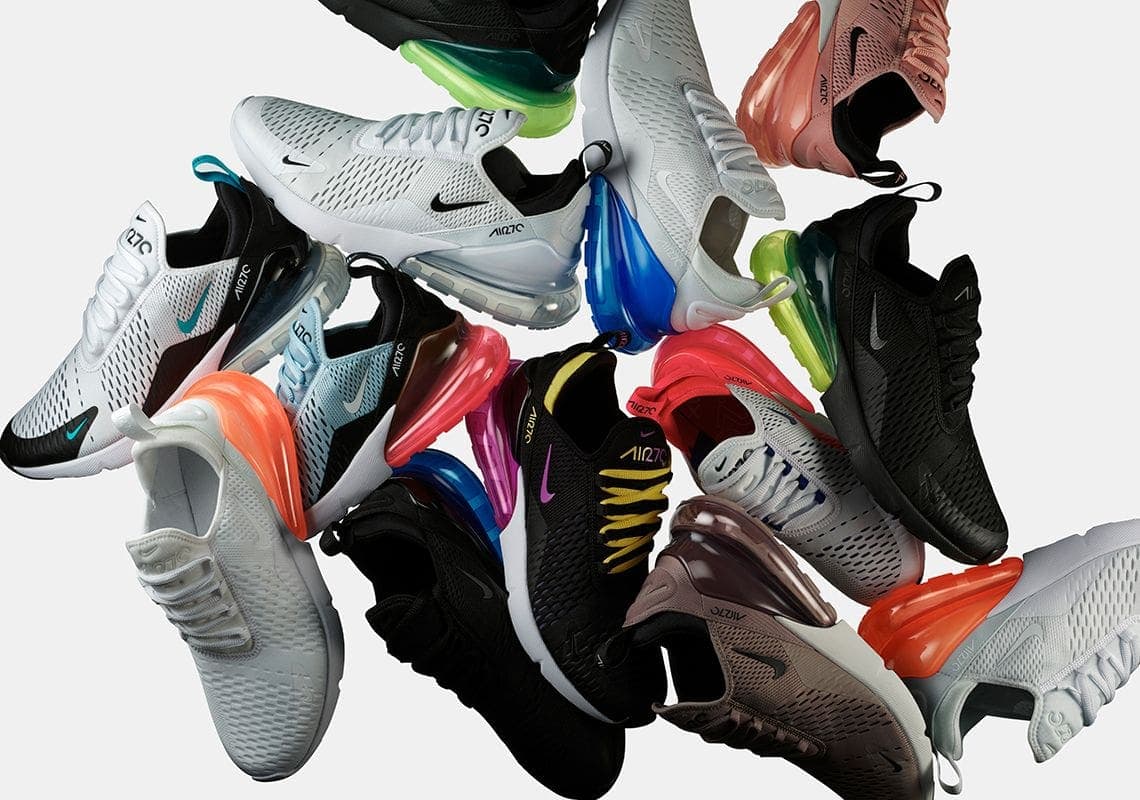 Nike sneakers arranged in a circular display with colorful Air units