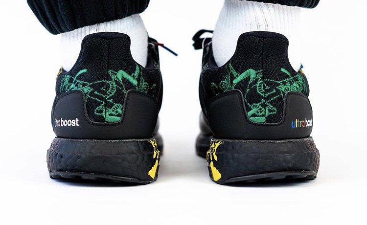 Heel view of black Disney x adidas Ultra Boost Goofy sneakers