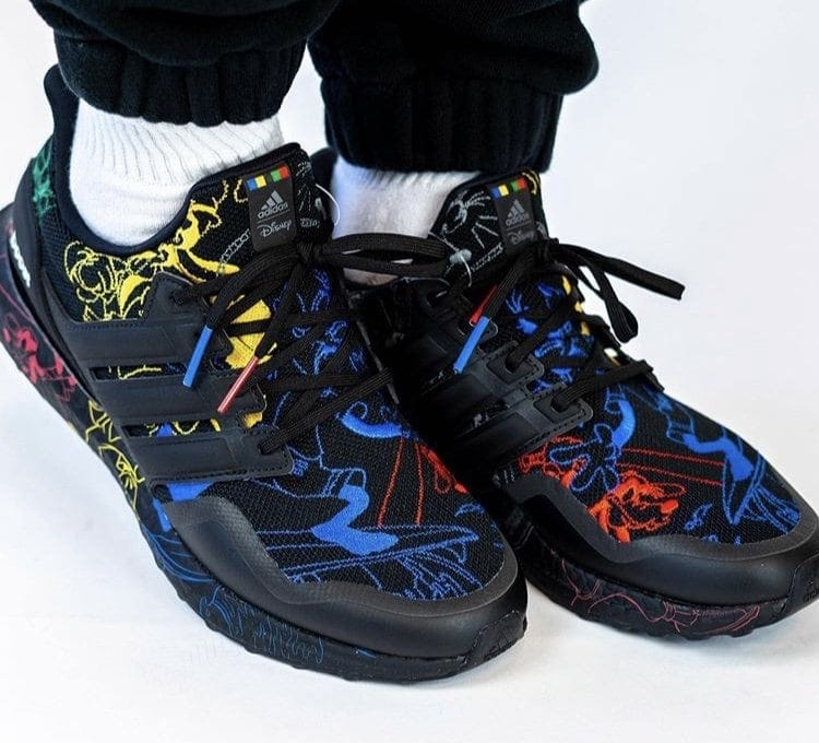 Front view of black Disney x adidas Ultra Boost Goofy sneakers