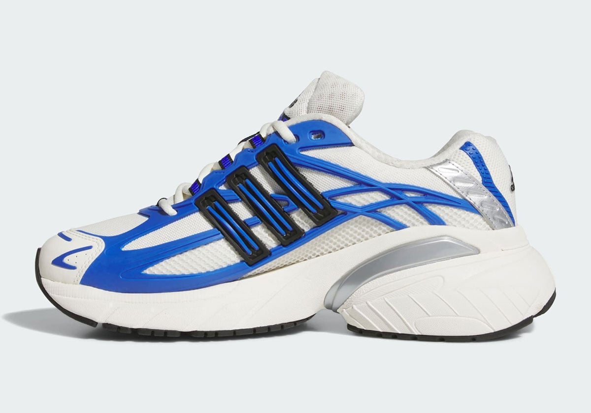 Medial side of the adidas Adistar XLG 2.0 in white mesh with royal blue overlays and a silver heel insert