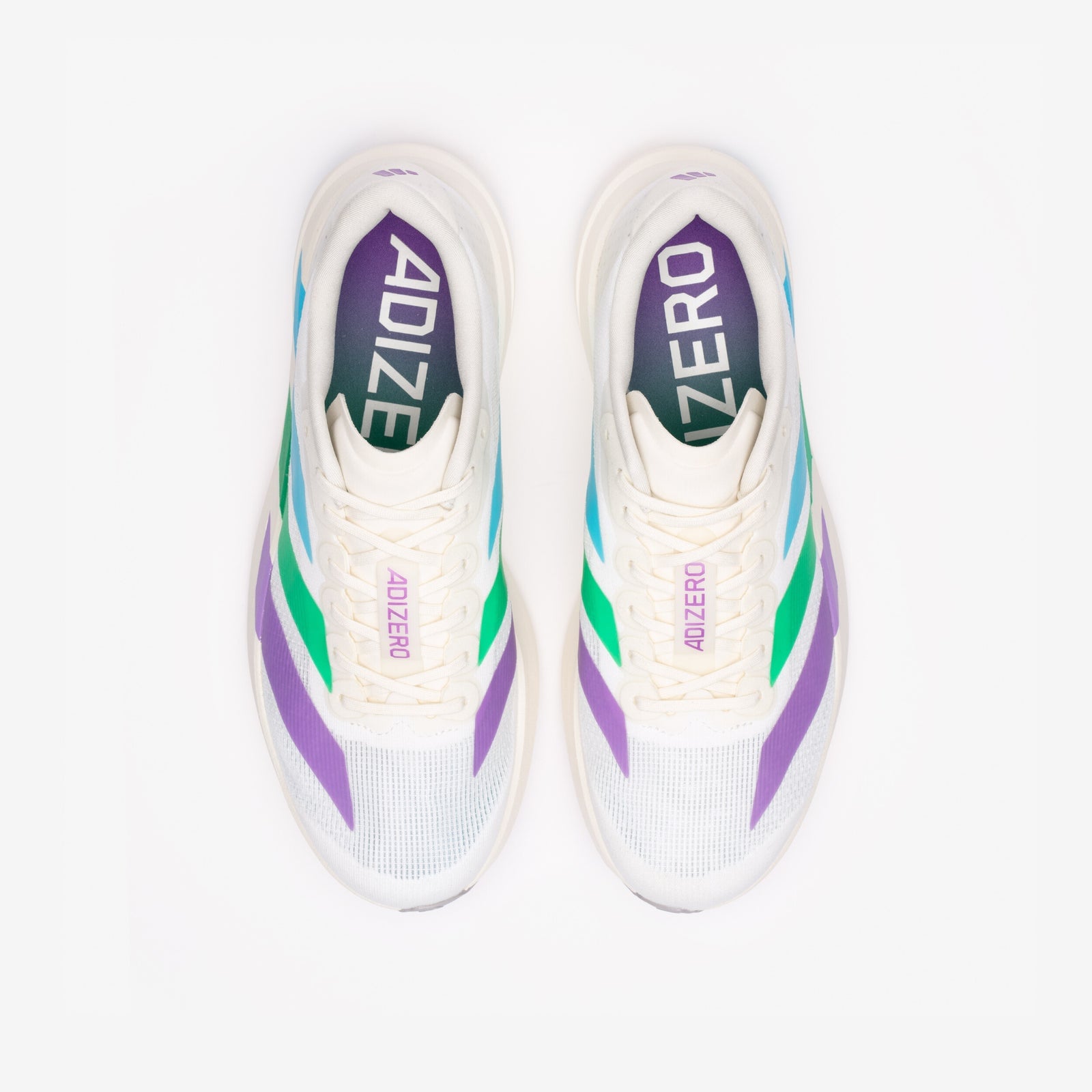 Top-down view of the pair with cream tongues and a purple-to-teal ADIZERO printed sockliner