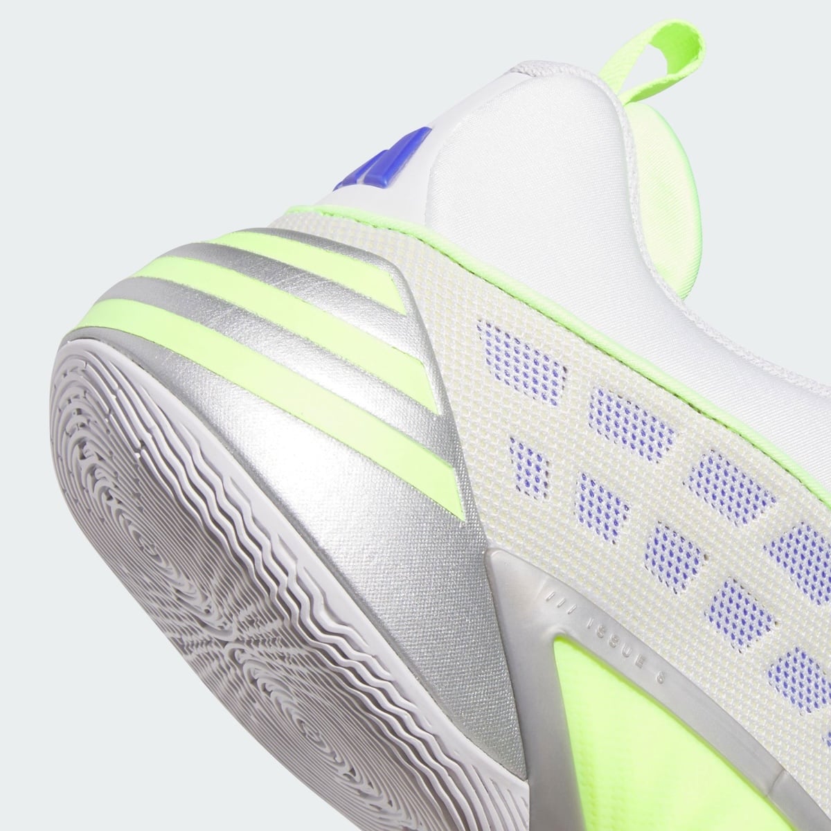 Close-up of the volt-green and metallic silver Three Stripes with DON Issue 8 debossing on the midfoot panel
