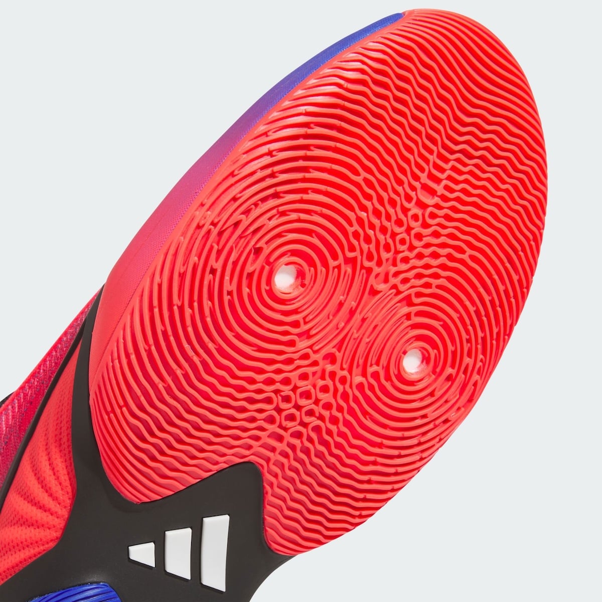Macro detail of the red forefoot traction on the DON Issue 8 with concentric web-inspired ripples