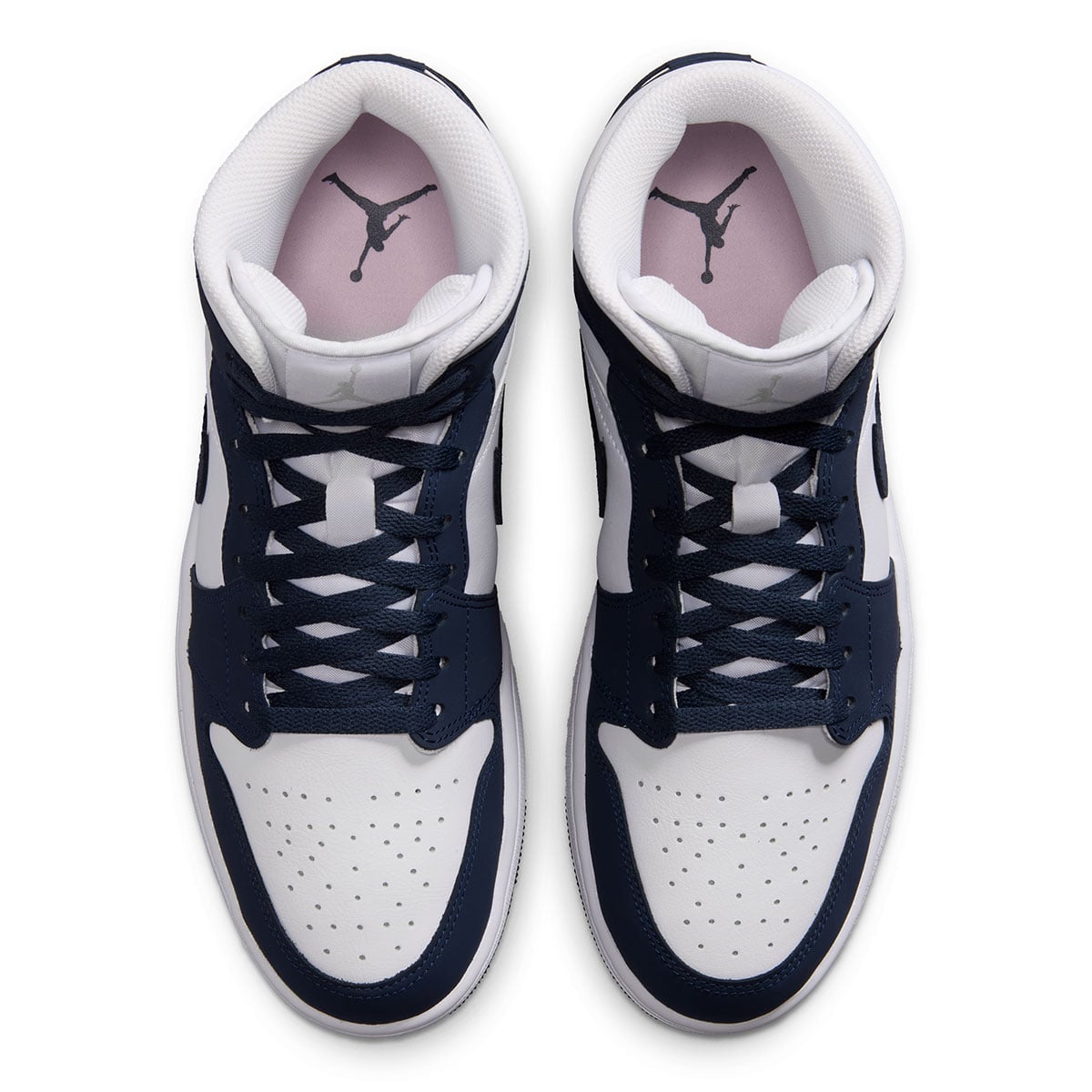 Top-down look at the soft pink insoles and grey Jumpman inside the Air Jordan 1 Mid Obsidian