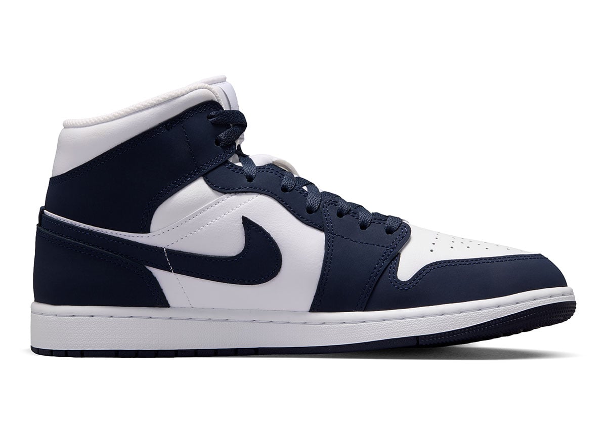 Medial side of the Air Jordan 1 Mid Obsidian colorway, showing the navy ankle panel and white midsole