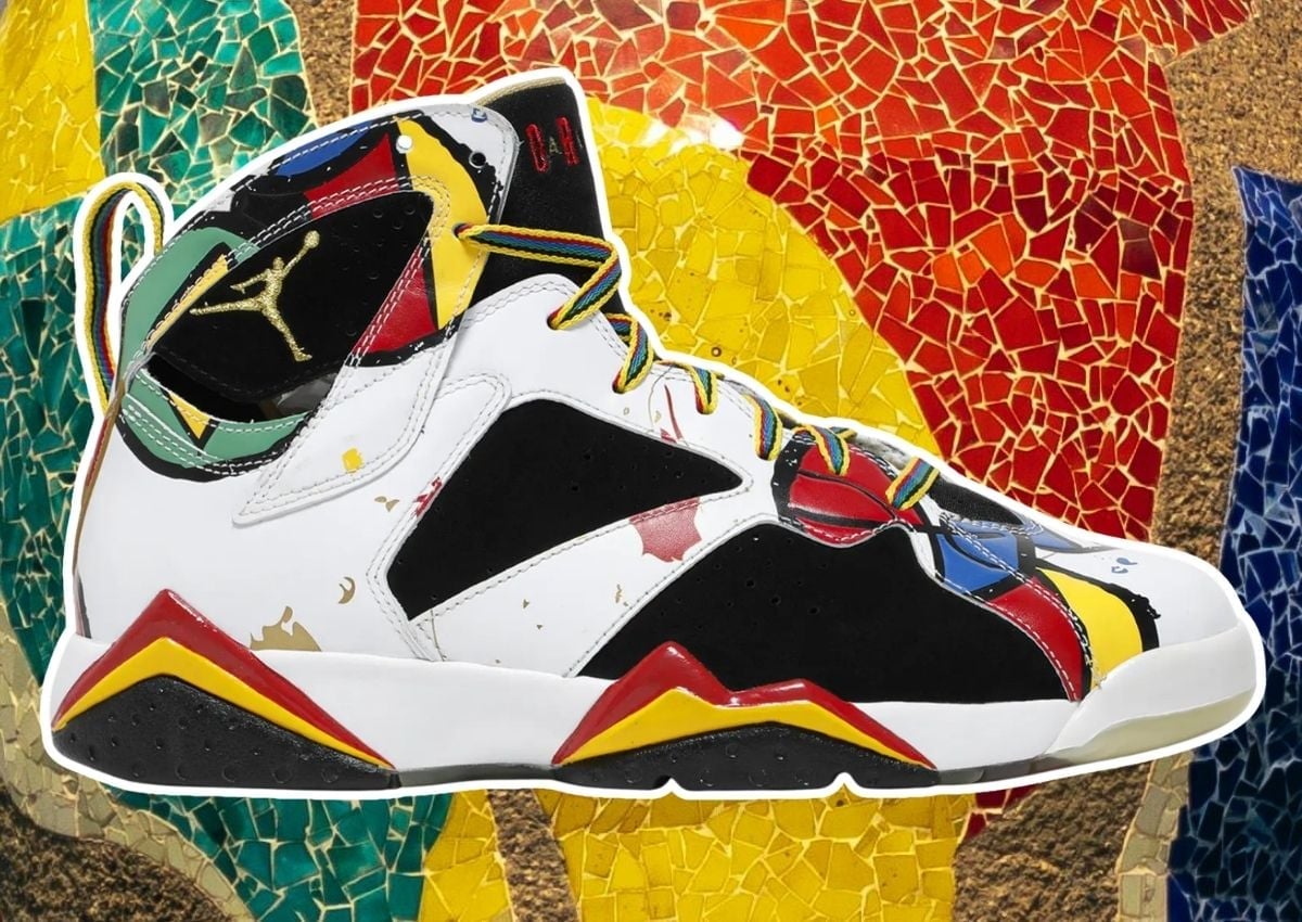 Lateral view of the Air Jordan 7 Miro in white leather with black nubuck panels and red, blue, green and yellow Miro-inspired accents