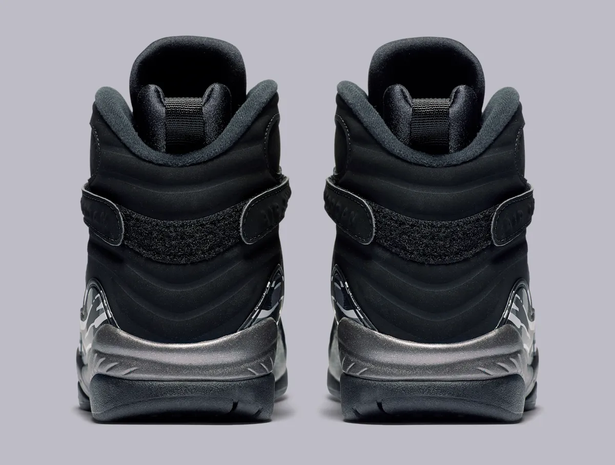Heel view of the Air Jordan 8 retro showing the woven heel panel and grey-to-chrome fade on the midsole