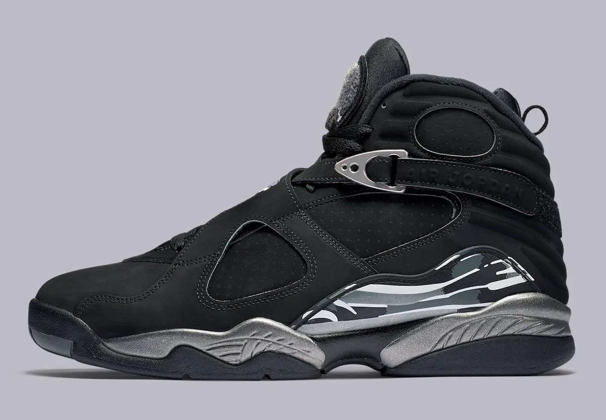 Lateral profile of the Air Jordan 8 "Chrome" in black nubuck with a polished chrome midsole and strap buckle