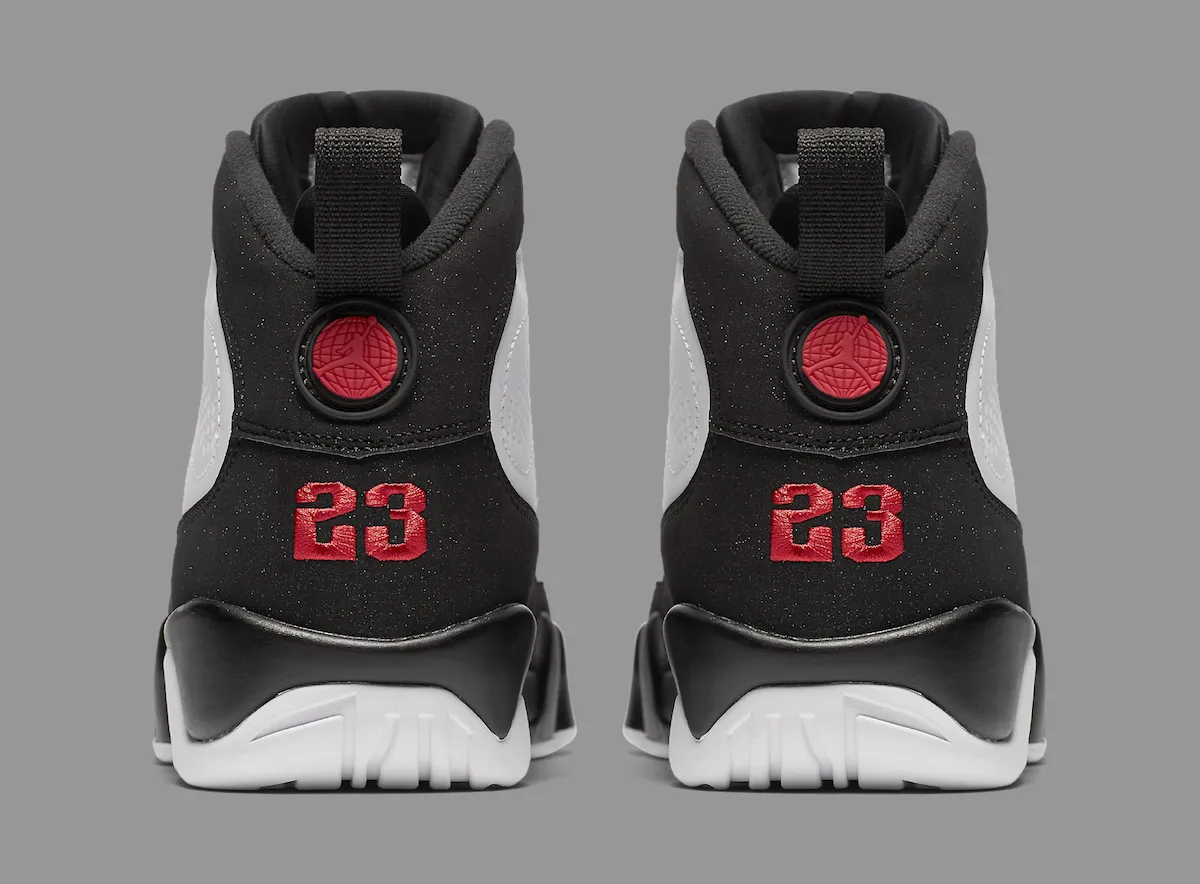 Heel detail of the black nubuck counters with red embroidered 23 and the Jumpman medallion on the pull tab