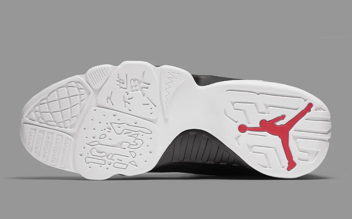 White outsole of the Air Jordan 9 OG White True Red Black showing the global-language motif and red Jumpman
