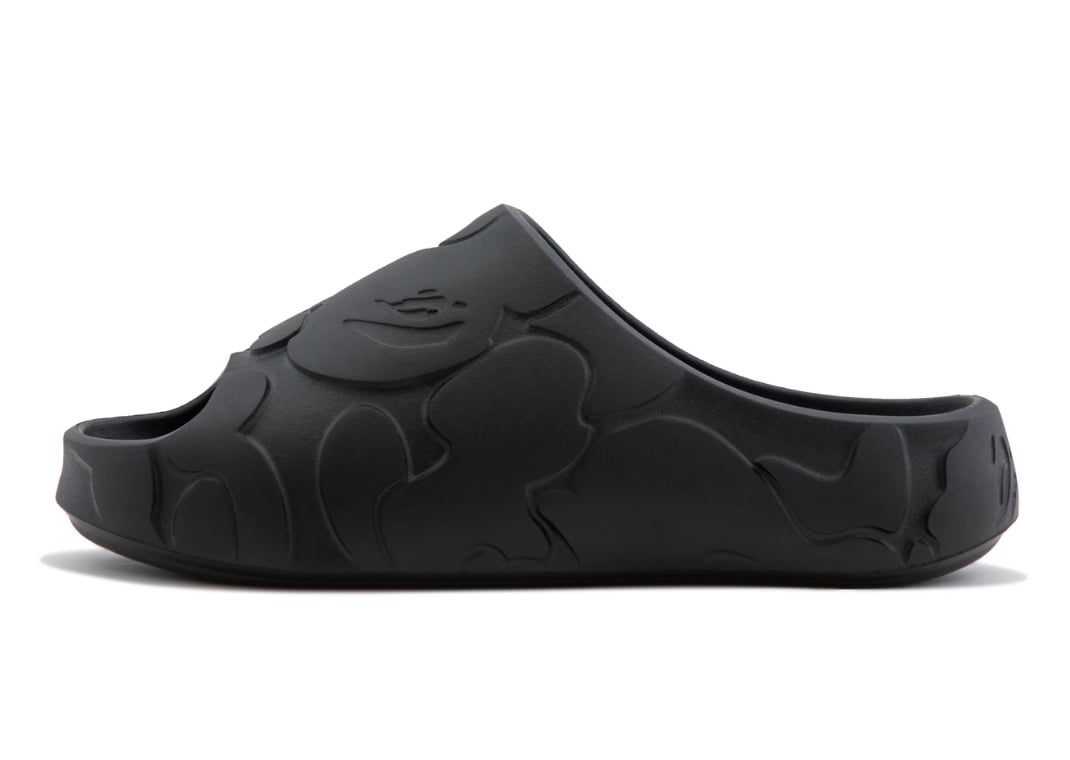 Lateral profile of the black BAPE Slide with the Solid Camo pattern carved into the midsole