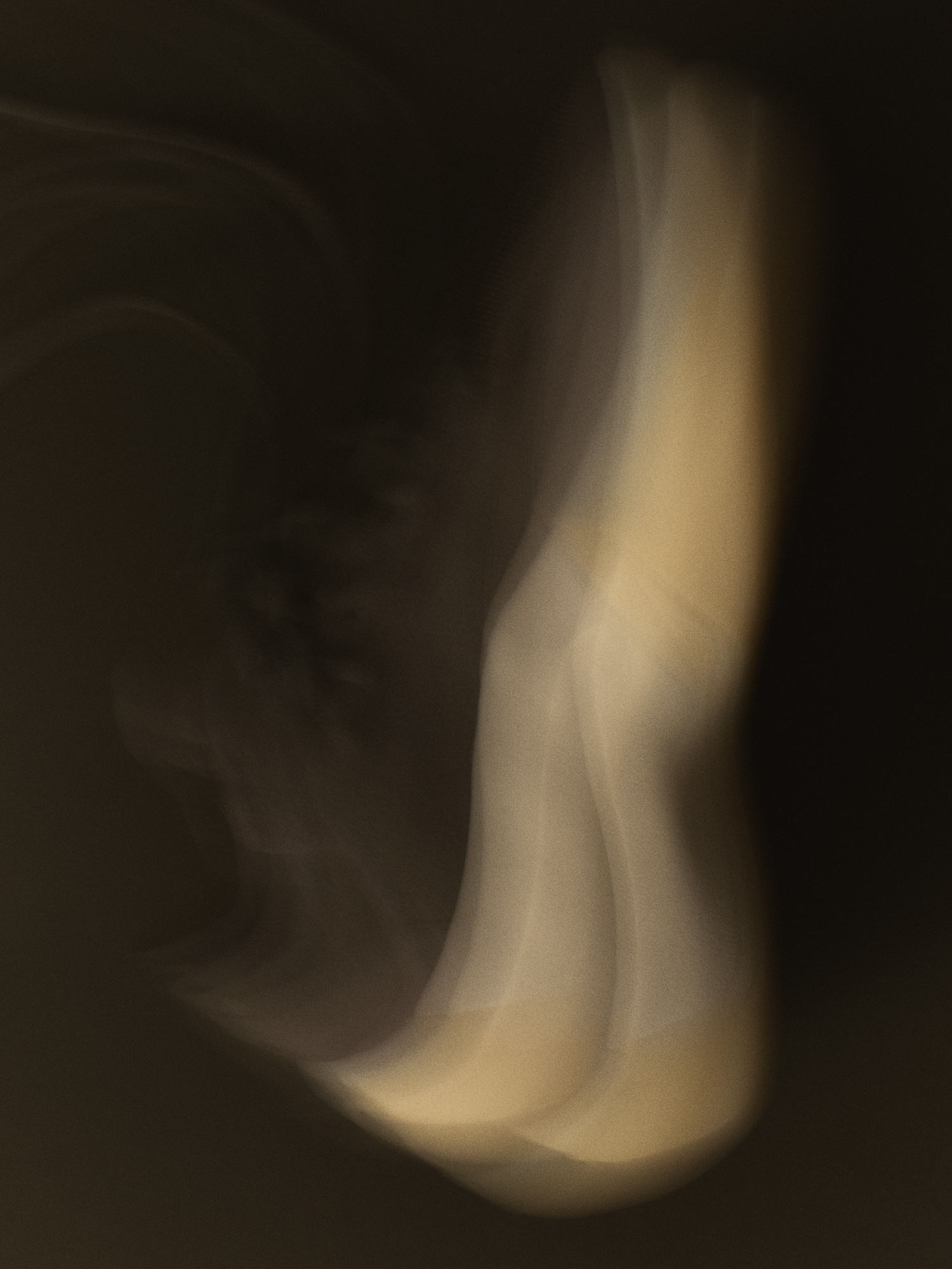 Abstract motion-blur editorial showing the curved midsole silhouette of the Fear of God Athletics III Basketball "Cinder"