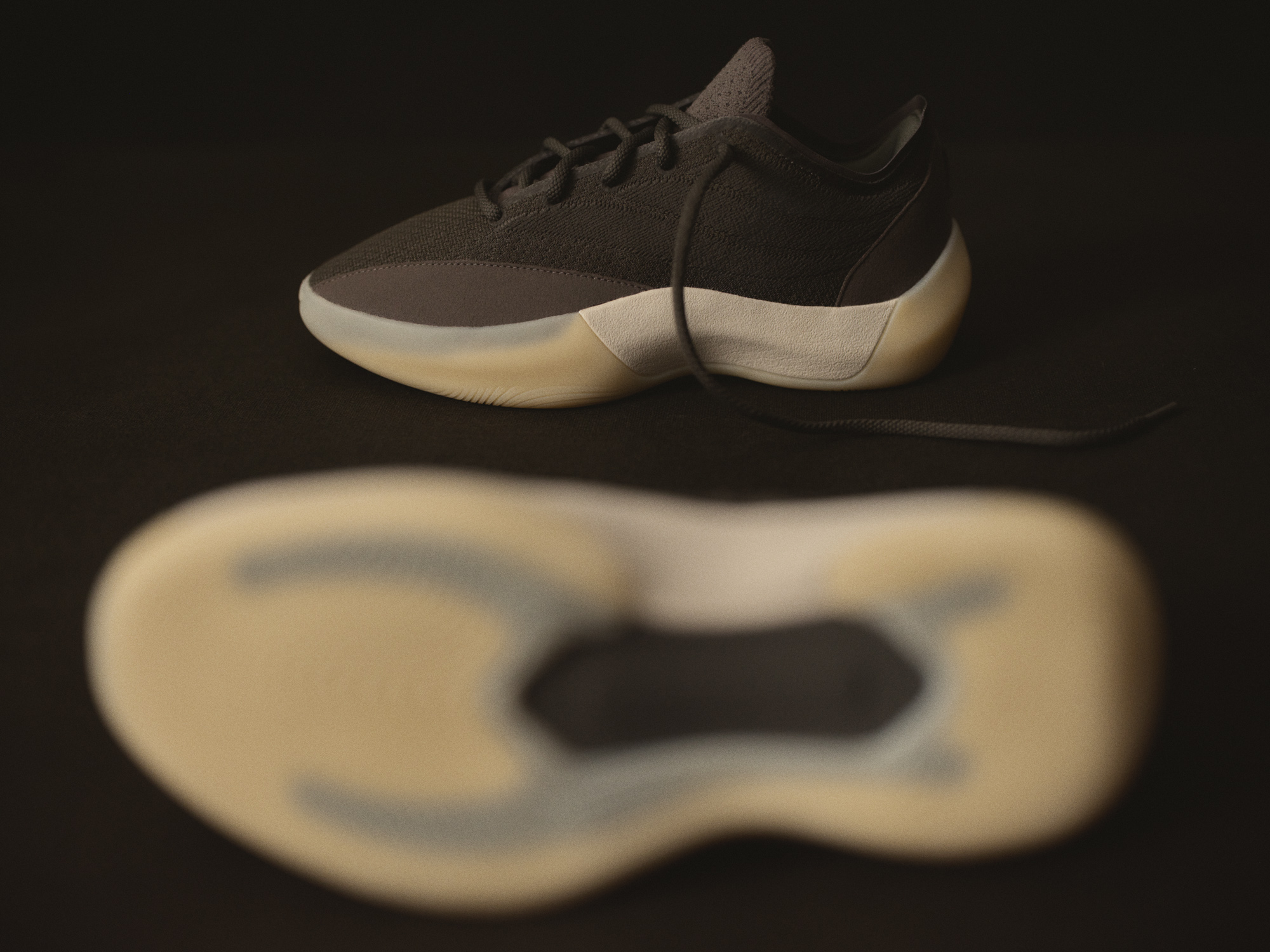 Outsole detail of the Fear of God Athletics III Basketball "Cinder" showing the bottom-loaded shank and Lightstrike tooling