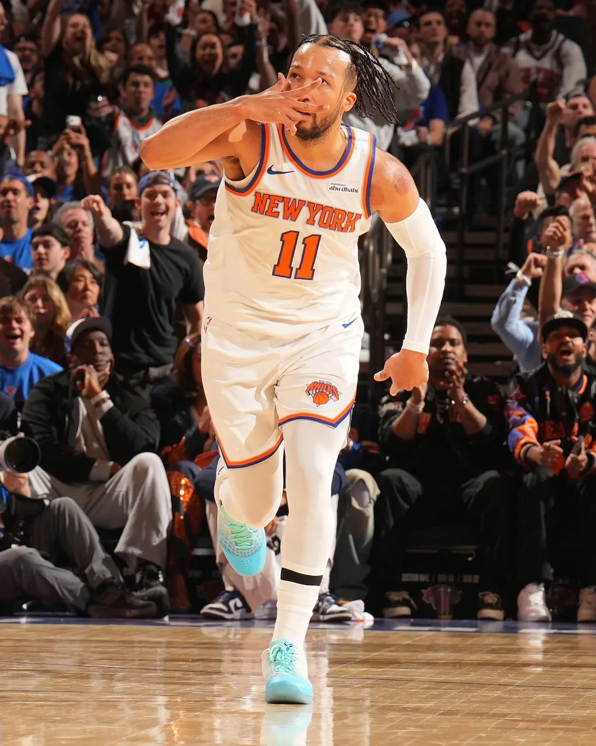 Jalen Brunson celebrates a basket at MSG in the Ice Blue Kobe 3 Low PE, the aqua upper visible against the Knicks home shorts