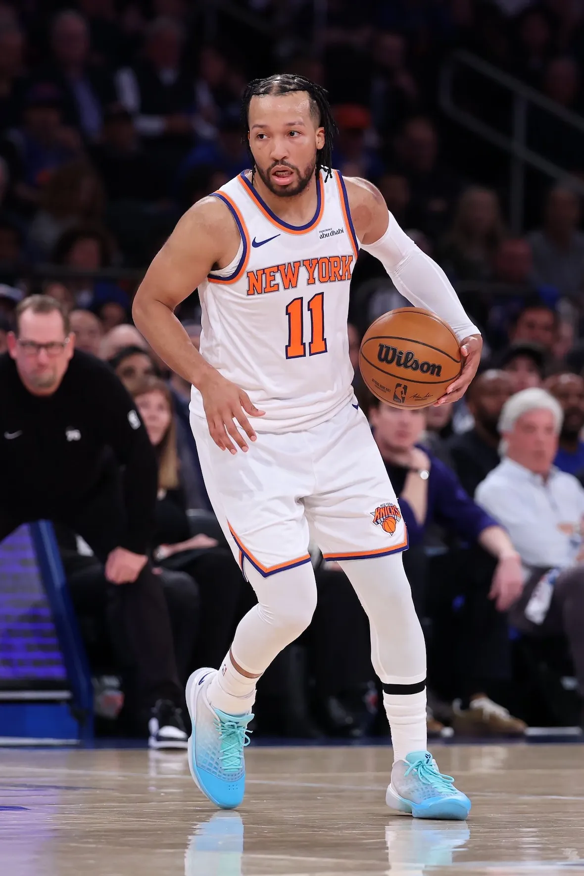 Jalen Brunson dribbling up the floor in the Knicks home whites and the Ice Blue Kobe 3 Low Protro PE during the second-round series