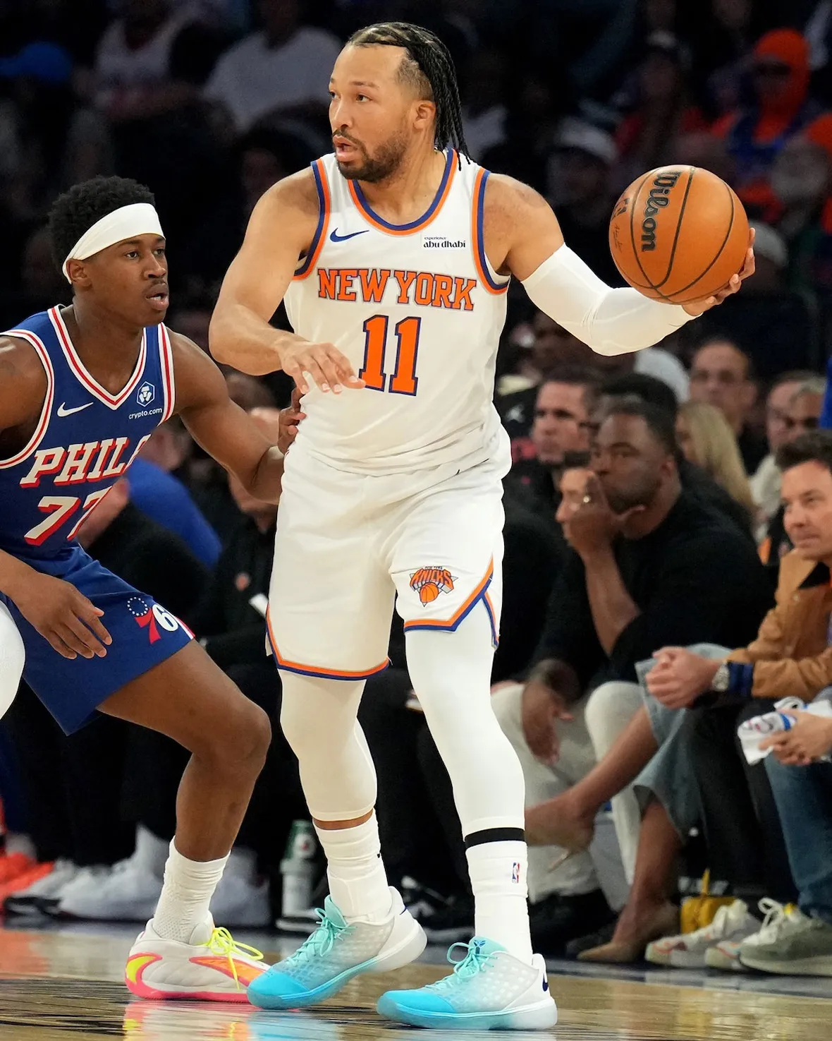 Jalen Brunson posts up against a Philadelphia defender in the Ice Blue Nike Kobe 3 Low PE during 2026 NBA Playoffs Game 1