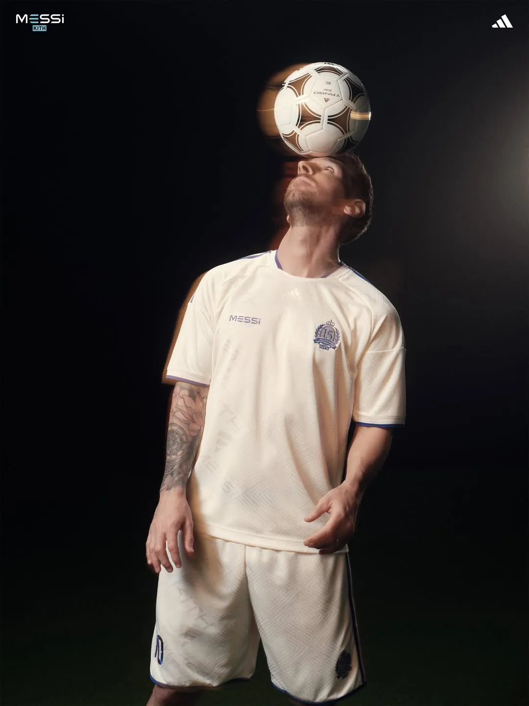 Cream 15th-anniversary jersey from the Kith adidas collection as Messi balances an adidas Tango ball on his head