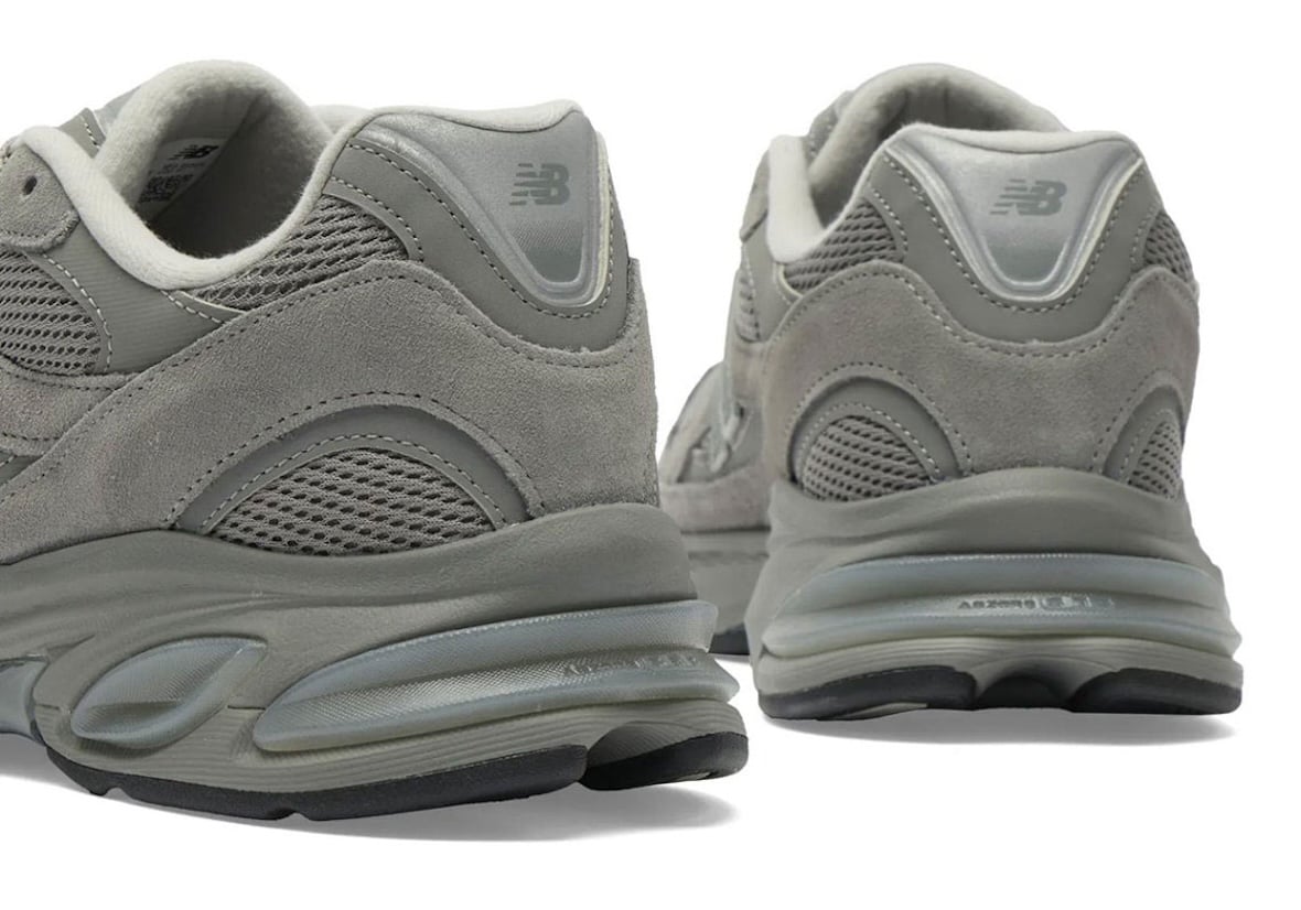 Heel view of two New Balance 2010 pairs showing grey suede counters and translucent ABZORB cushioning pods