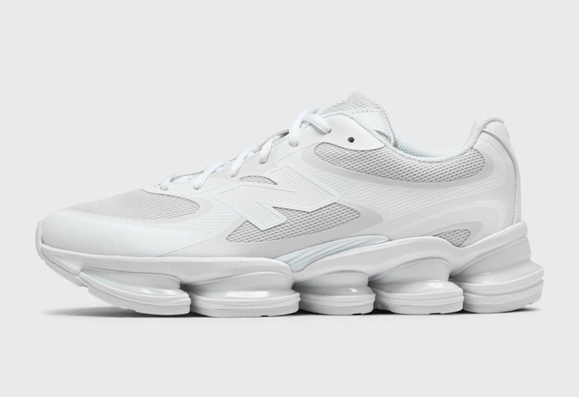 Lateral view of the all white New Balance ABZORB 2000 showing the segmented wavy pod tooling