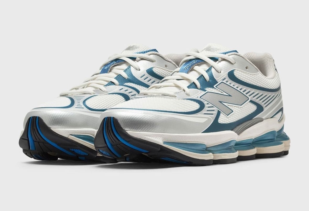 Pair of the white and teal New Balance 2000 with chrome side panels and translucent teal midsole pods