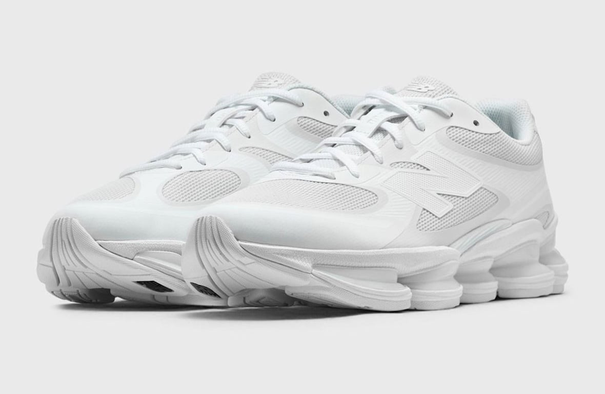 Pair of the tonal all white New Balance 2000 with sculpted shell and exposed white midsole pods