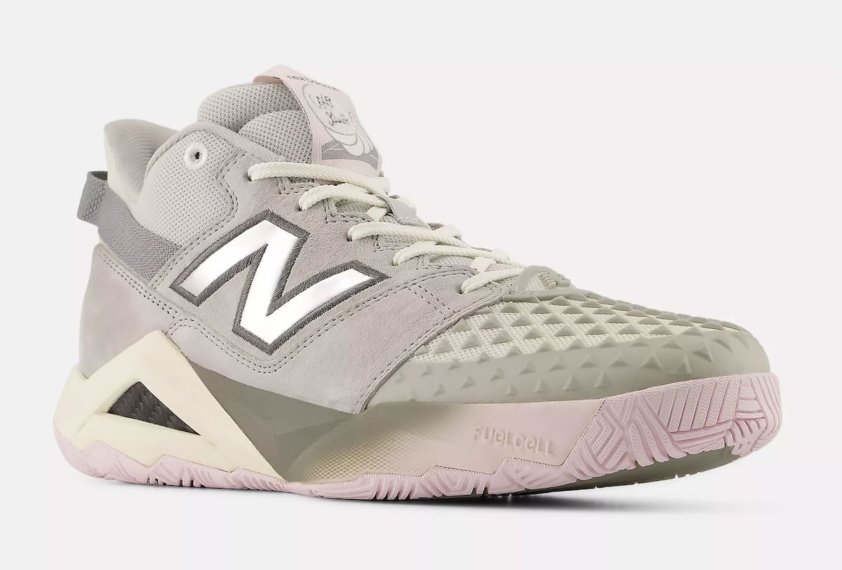 Front three-quarter angle showing the textured triangular toe guard and silver N on the Coco CG2 tennis shoe