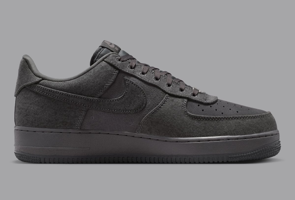 Medial side of the Nike Air Force 1 Low Denim showing the faded denim panels and suede toe box