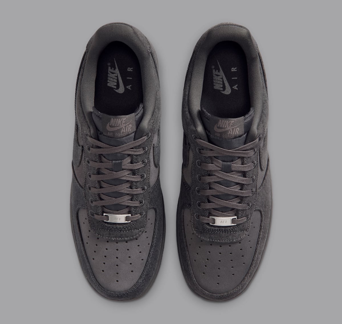 Top-down look at the pair, with tonal Nike Air insoles and silver AF1 metal lace dubraes
