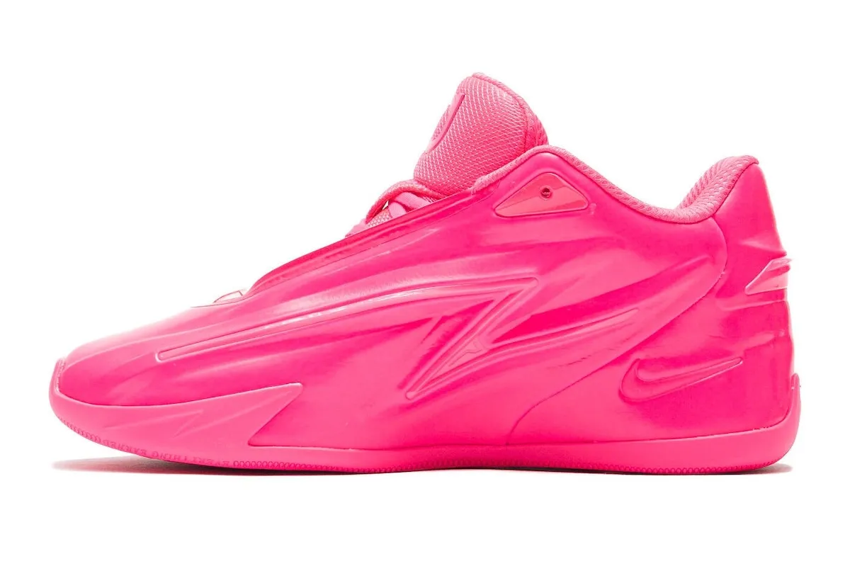 Medial side of the KD 19 in glossy pink, showing the embossed KD tongue logo and lightning-bolt shaping