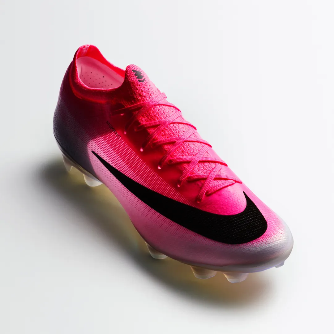 Front three-quarter look at the Mercurial Vapor 17 in hot pink with a black Swoosh and rounded studs