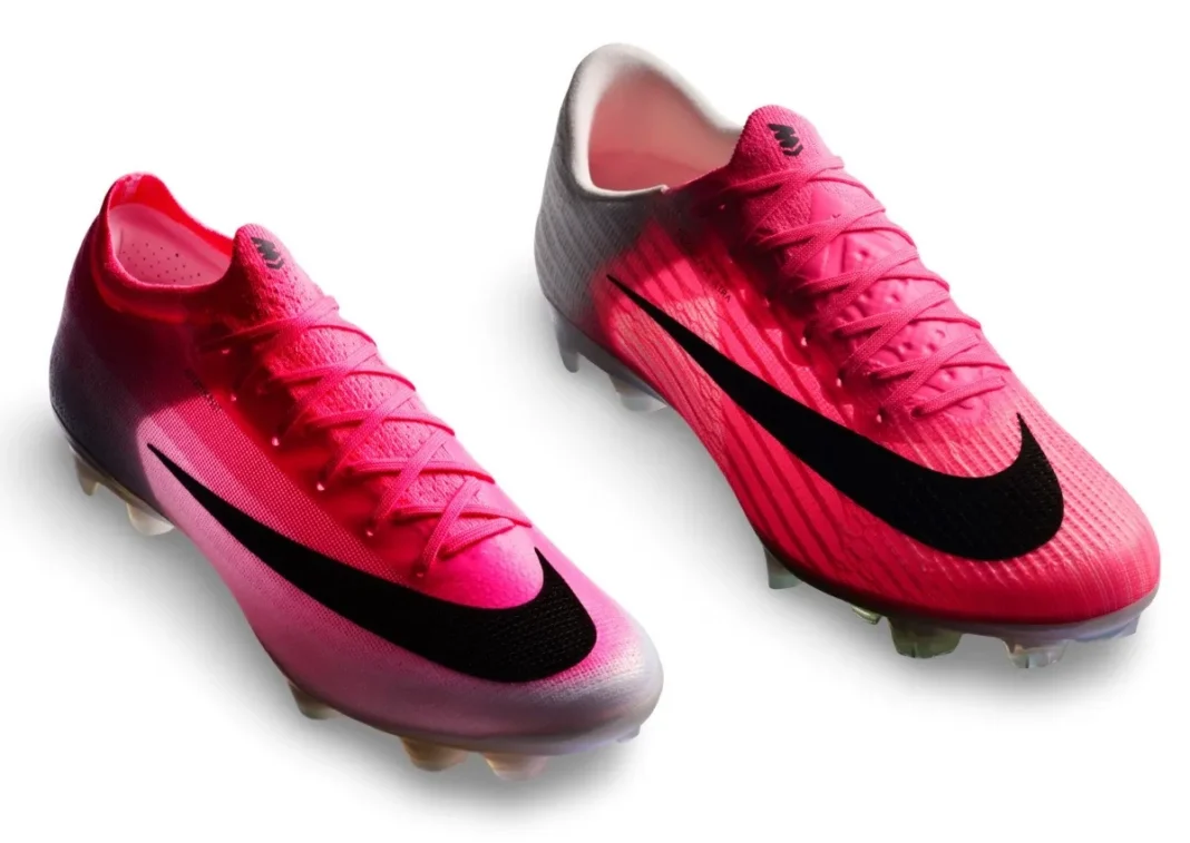 Studio pair shot of the pink Nike Mercurial Vapor 17 and Superfly 11 with black Swooshes on white