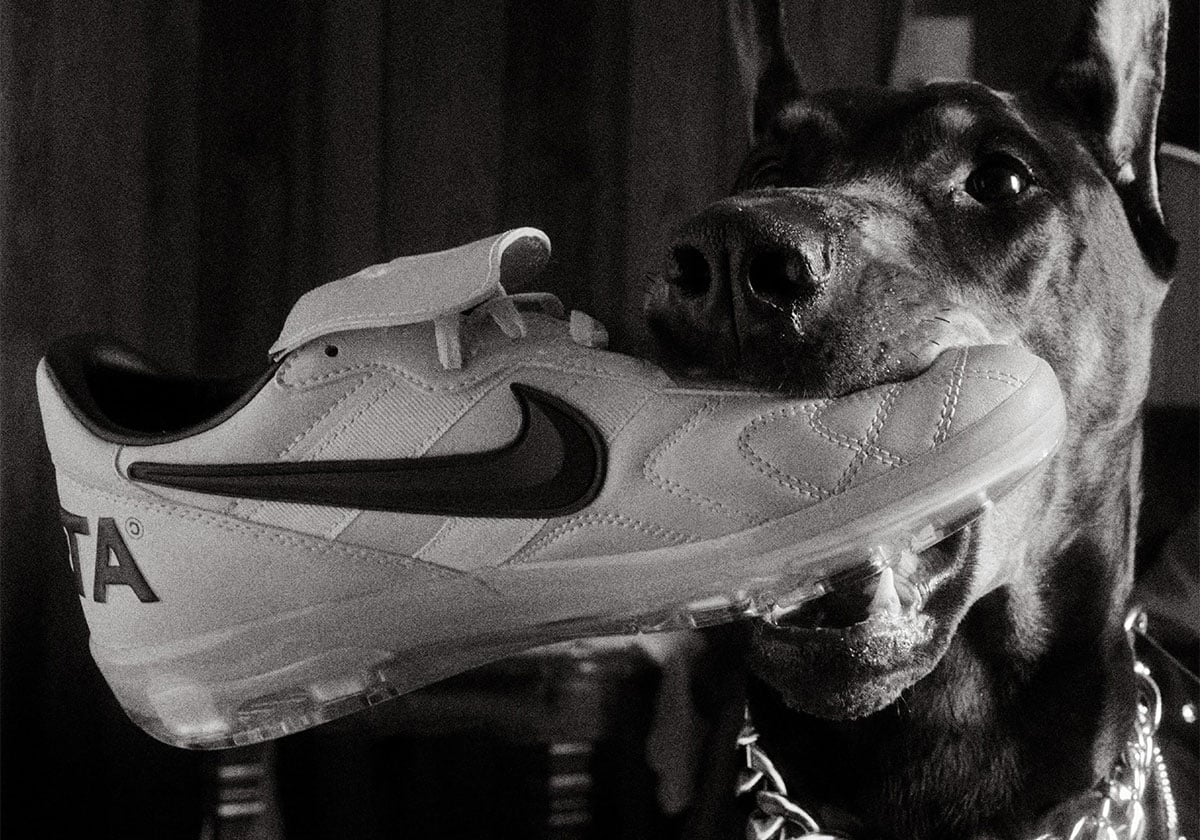 Clean side profile of the white NOCTA Nike Cryoshot showing the Tiempo-style stitched leather and clear sole
