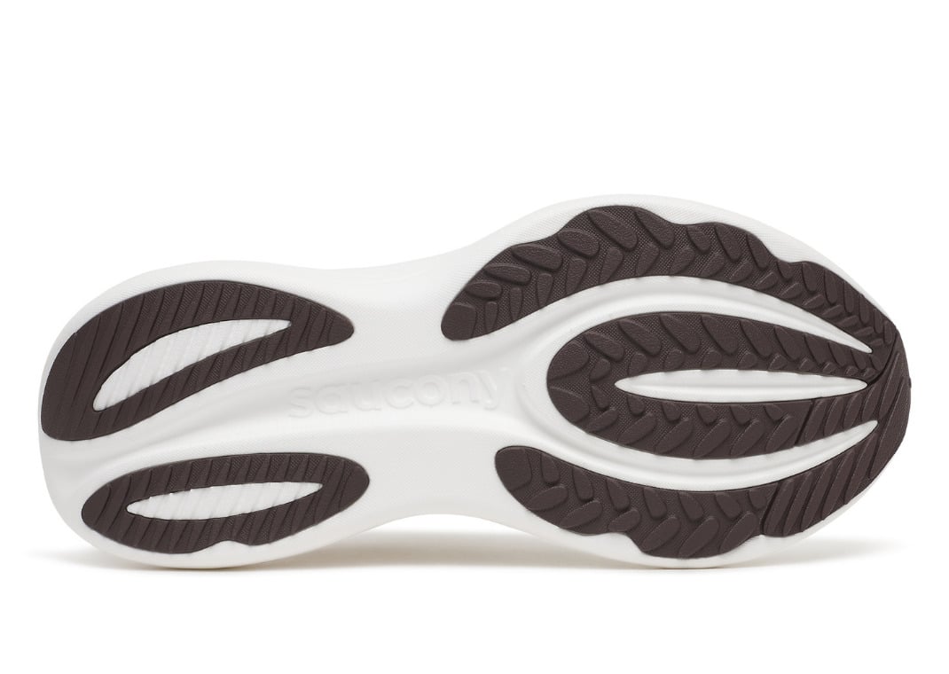 Brown carbon rubber outsole of the Triumph 24 with a segmented forefoot and exposed white foam pods