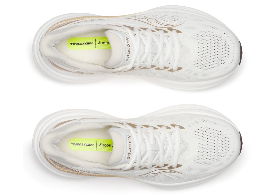 Top-down look at the breathable mesh upper of the ivory Triumph 24 with a neon neutral-cushioning insole tag