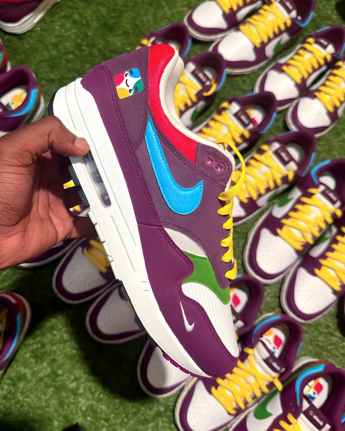 Side and top view of the Slack Air Max 1 custom showing the sky-blue Swoosh, white midsole and Slack logo on the tongue