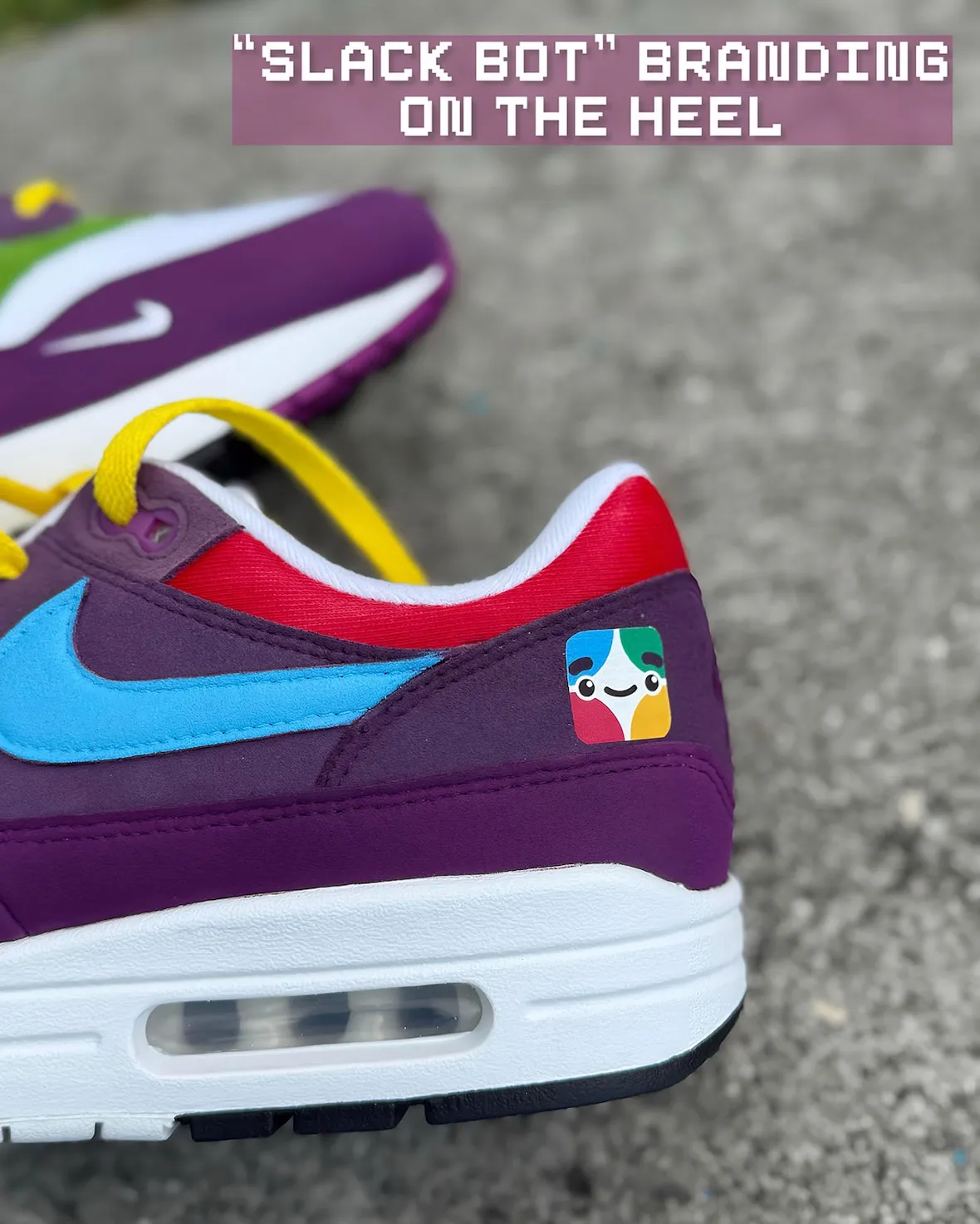 Heel detail of the Air Max 1 custom with the colorful SlackBot mascot patch above the visible Air unit