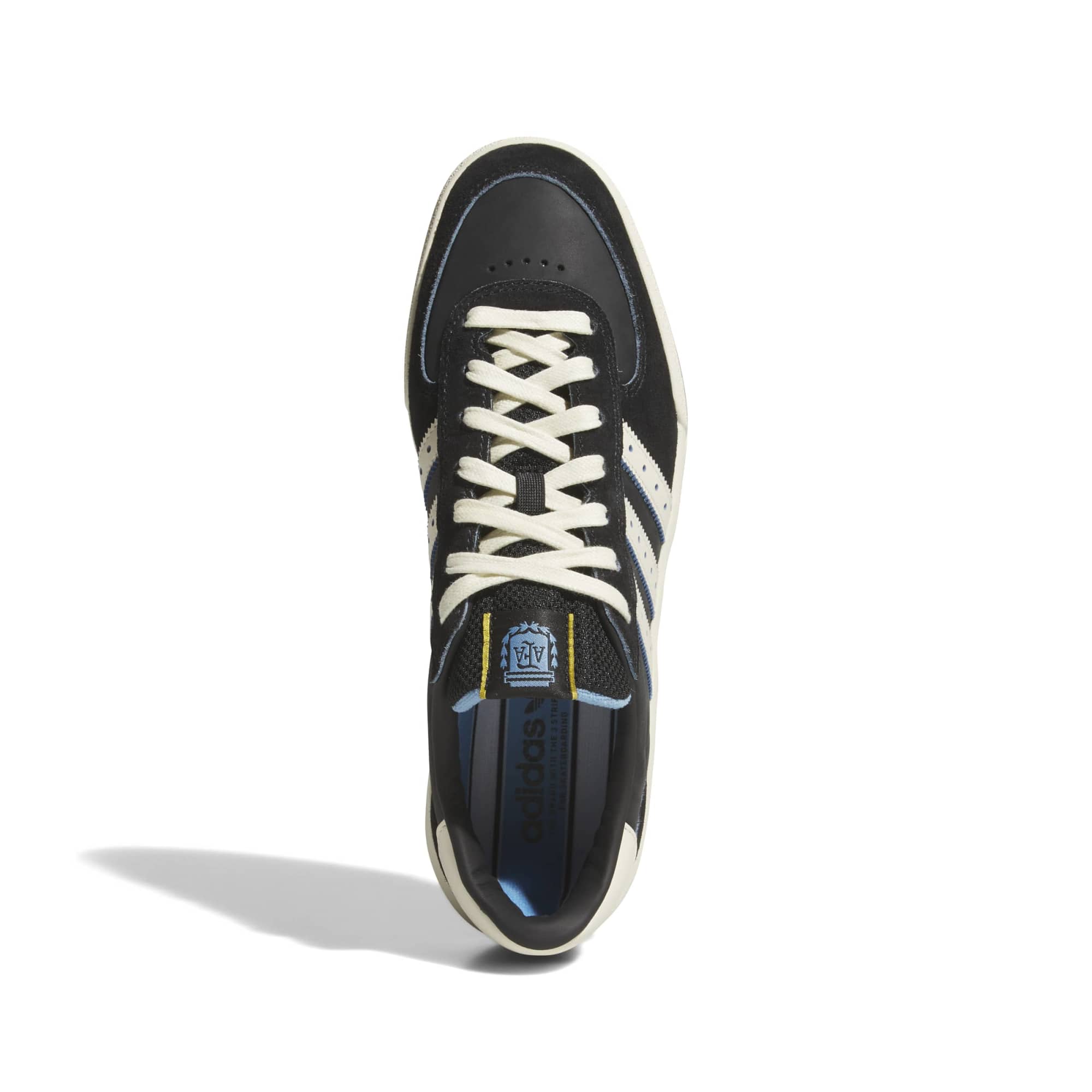 Top-down look at the black mesh tongue, blue lining, and AFA Argentina crest tongue tag on this adidas skate shoe