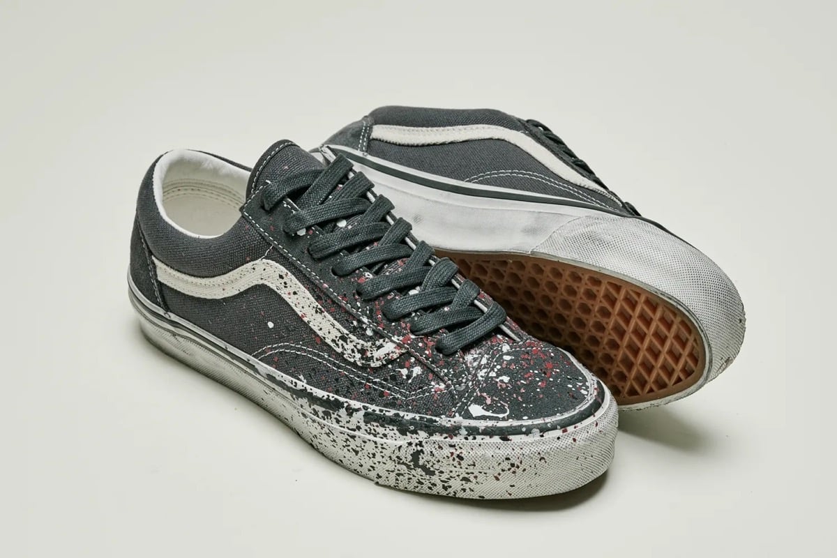 Charcoal Grey pair with a cream sidestripe, white and red splatter, and a gum waffle outsole
