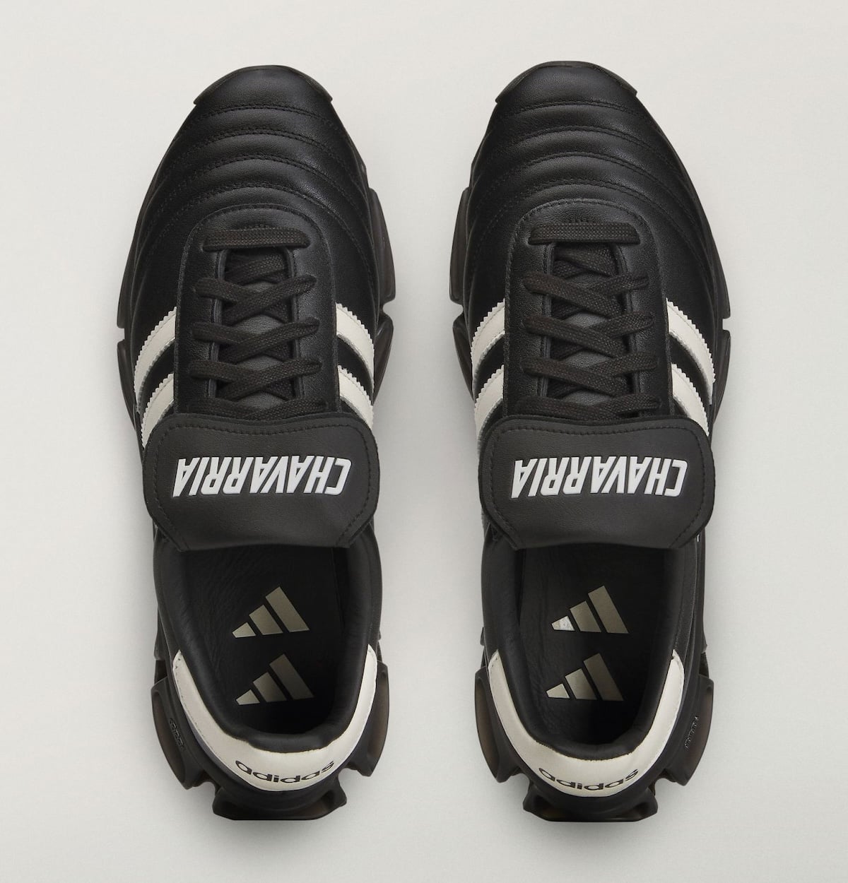 Top-down look at the pair with fold-over CHAVARRIA tongue straps and adidas Badge of Sport sockliners