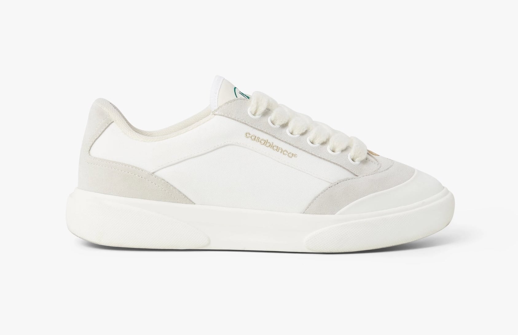 Lateral view of the Casablanca Del Mar sneaker in off-white, with white canvas, grey suede overlays and a cream cupsole
