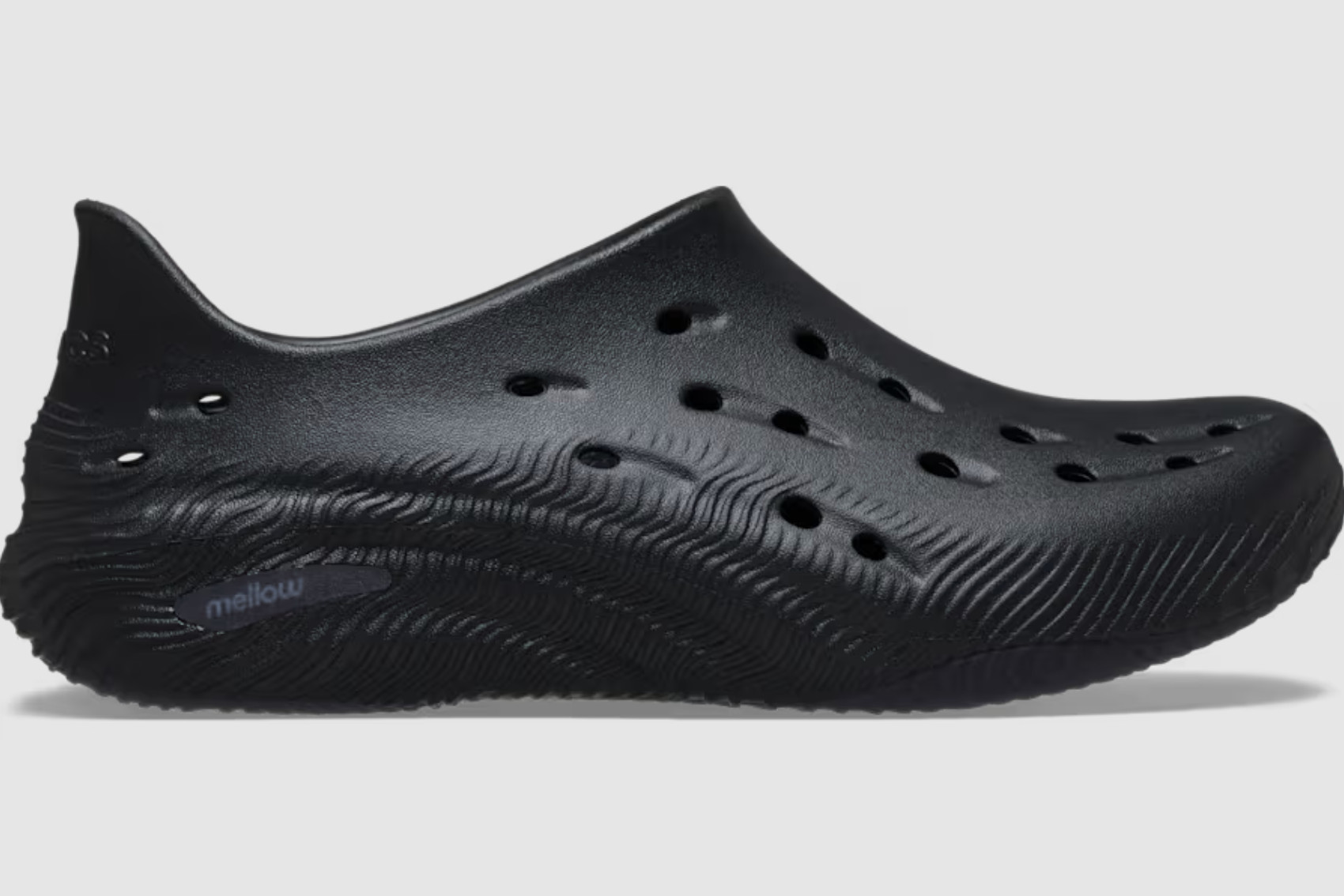Black Crocs Mellow 2 side profile with ventilation holes and a textured, sculpted sole