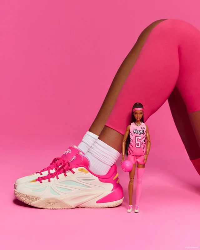 The Angel Reese 1 'Barbie' shoe beside the Barbie Signature doll in a matching pink kit