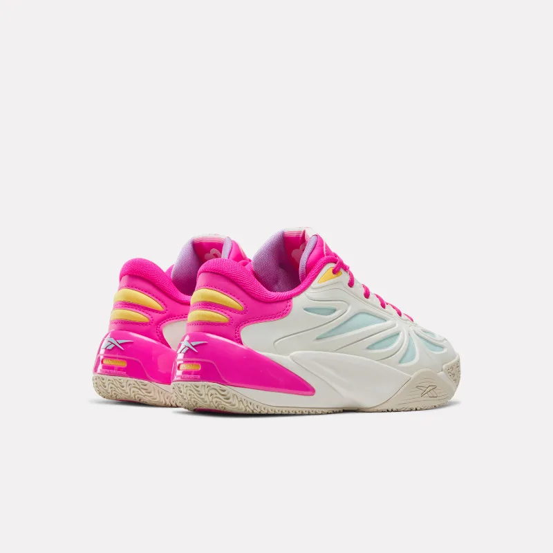 Rear three-quarter view of the pair showing pink patent heels, yellow accents, and cream midsoles