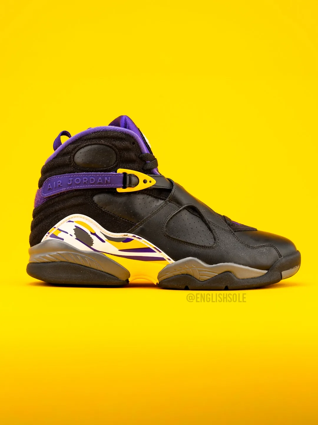 lateral view, black upper with purple collar and yellow strap buckle, Bryant PE Pack