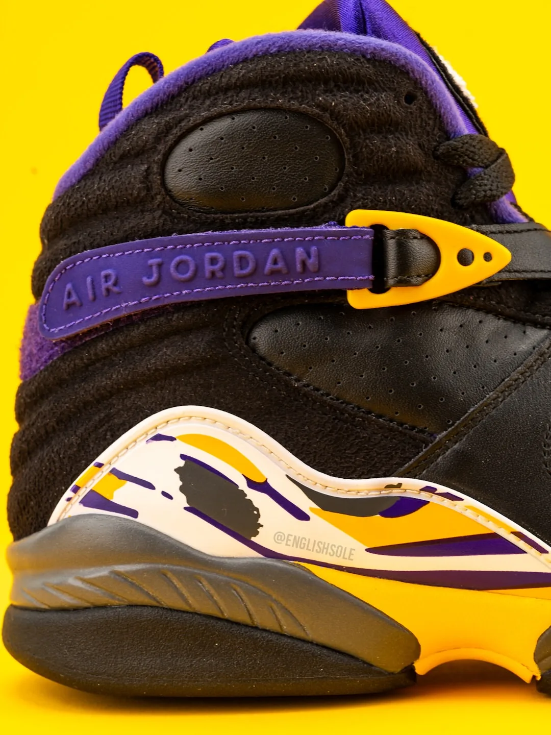 detail of heel strap, black suede with air jordan text and yellow buckle, Bryant PE Pack