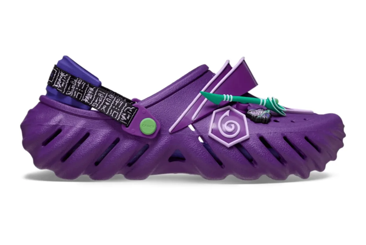 lateral view, purple clog with lilac swirl badge and teal arrow charm, x Crocs Collection