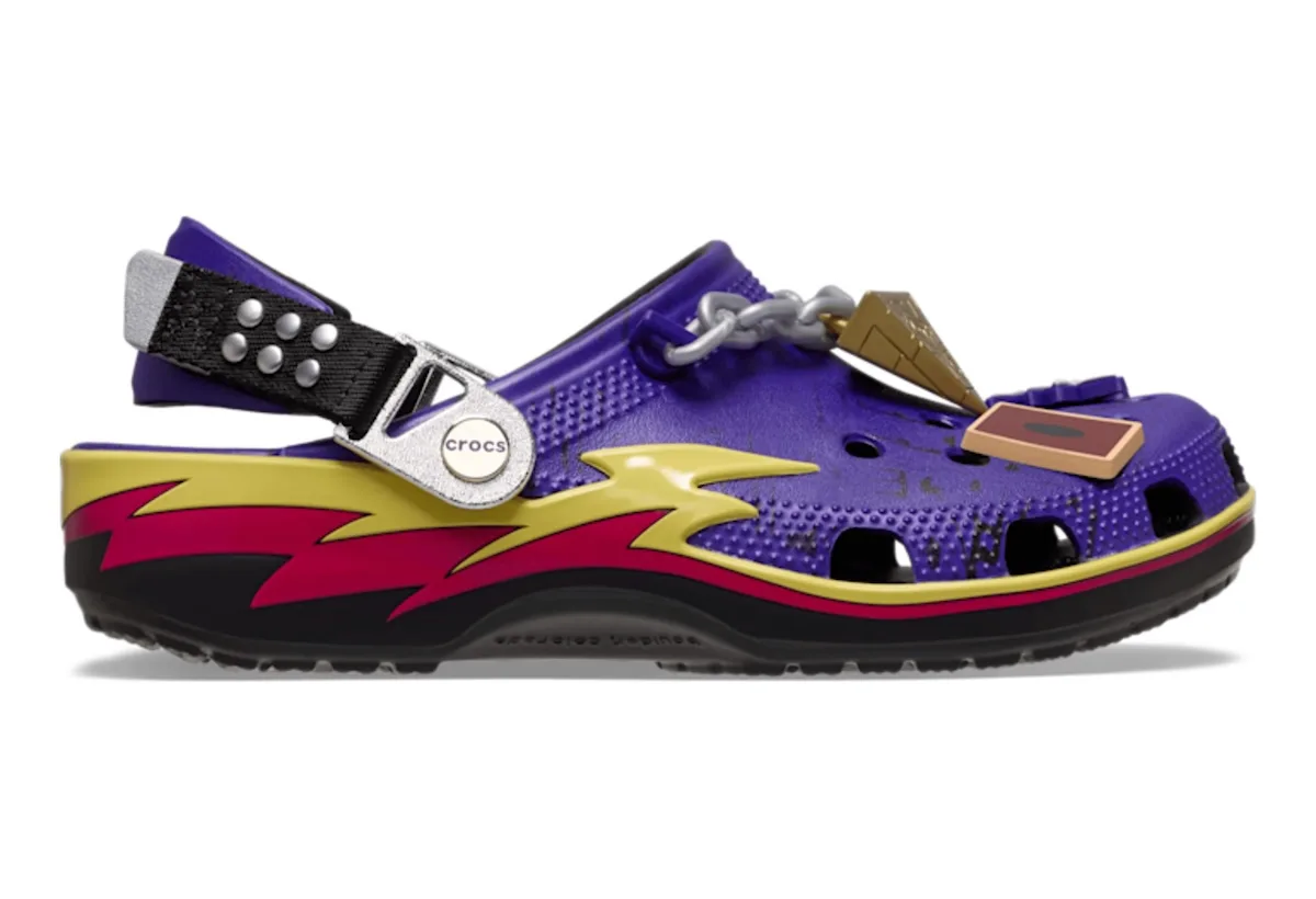 lateral view, purple clog with yellow and red lightning graphic and gold pyramid charm, x Crocs Collection