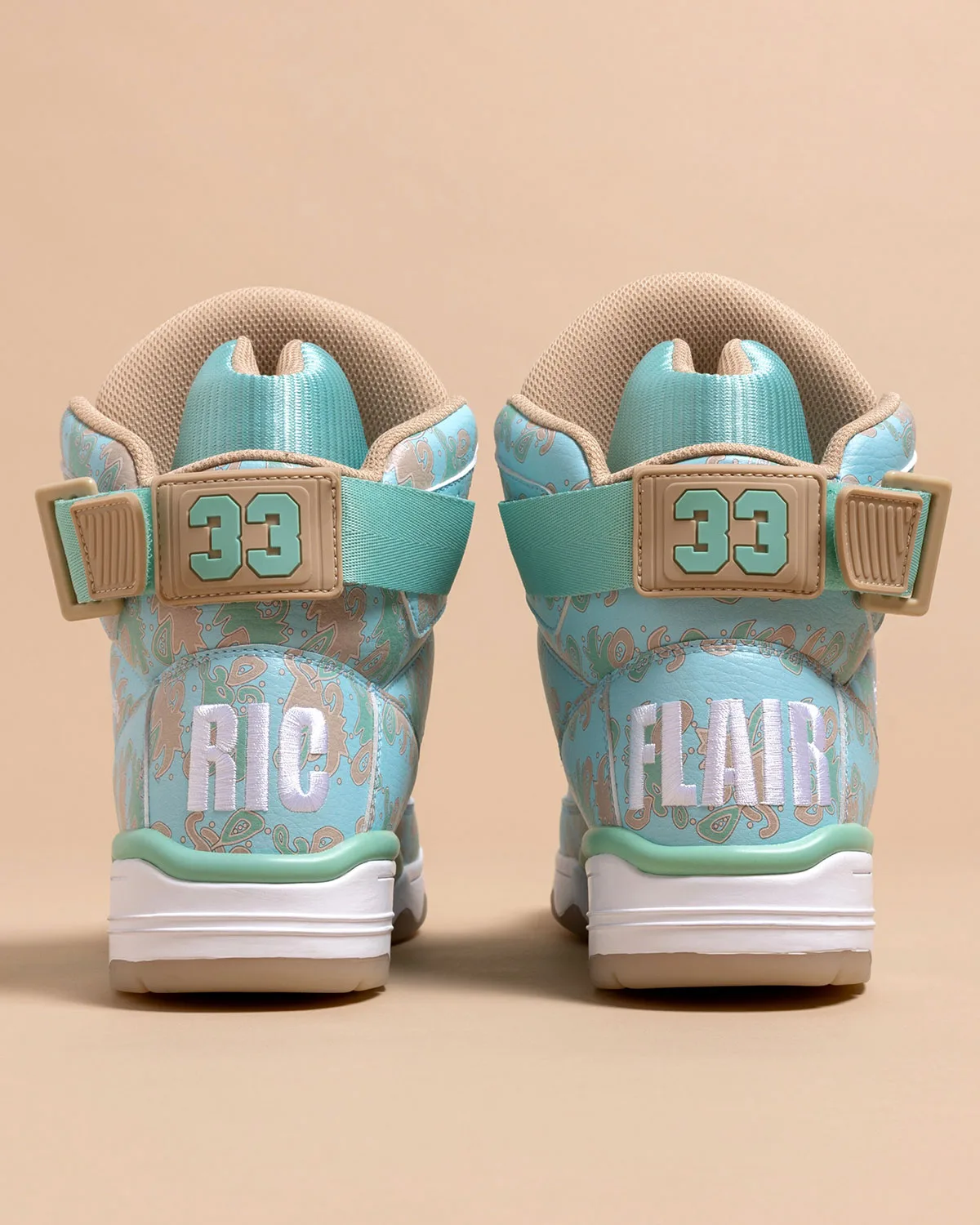 heel view of pair, teal 33 ankle strap with RIC FLAIR embroidered lettering, x Ric Flair