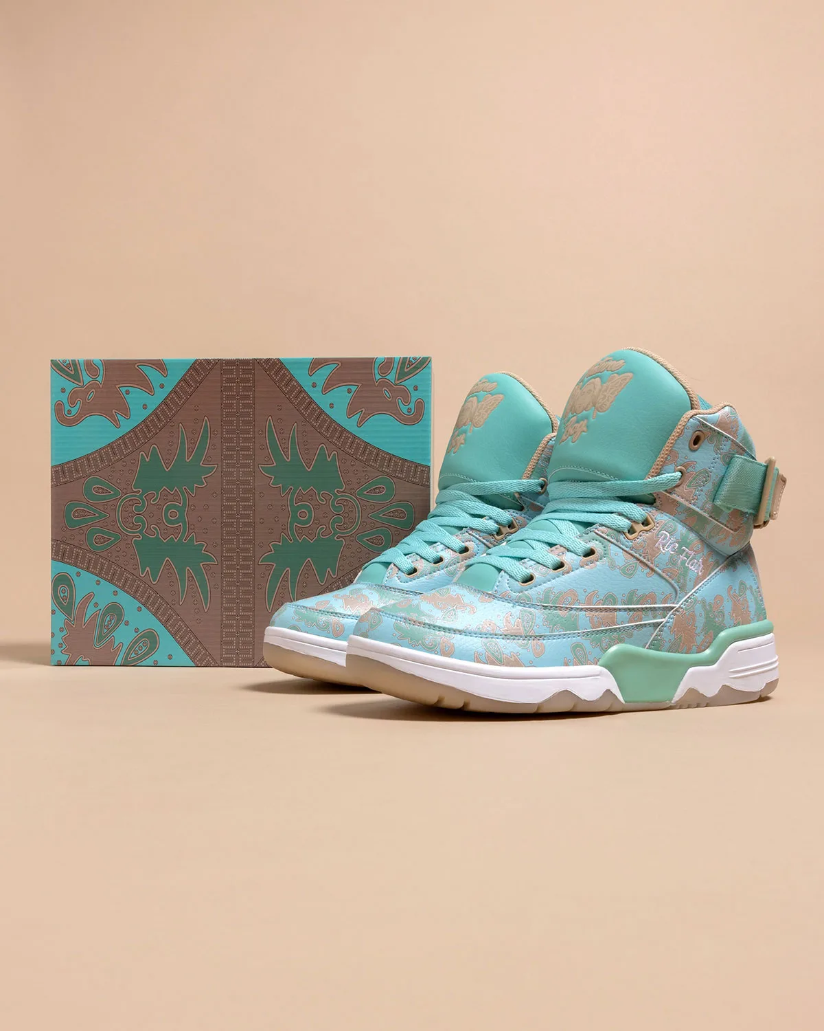 pair beside patterned box panel, turquoise paisley with mint outsole and tan trim, x Ric Flair
