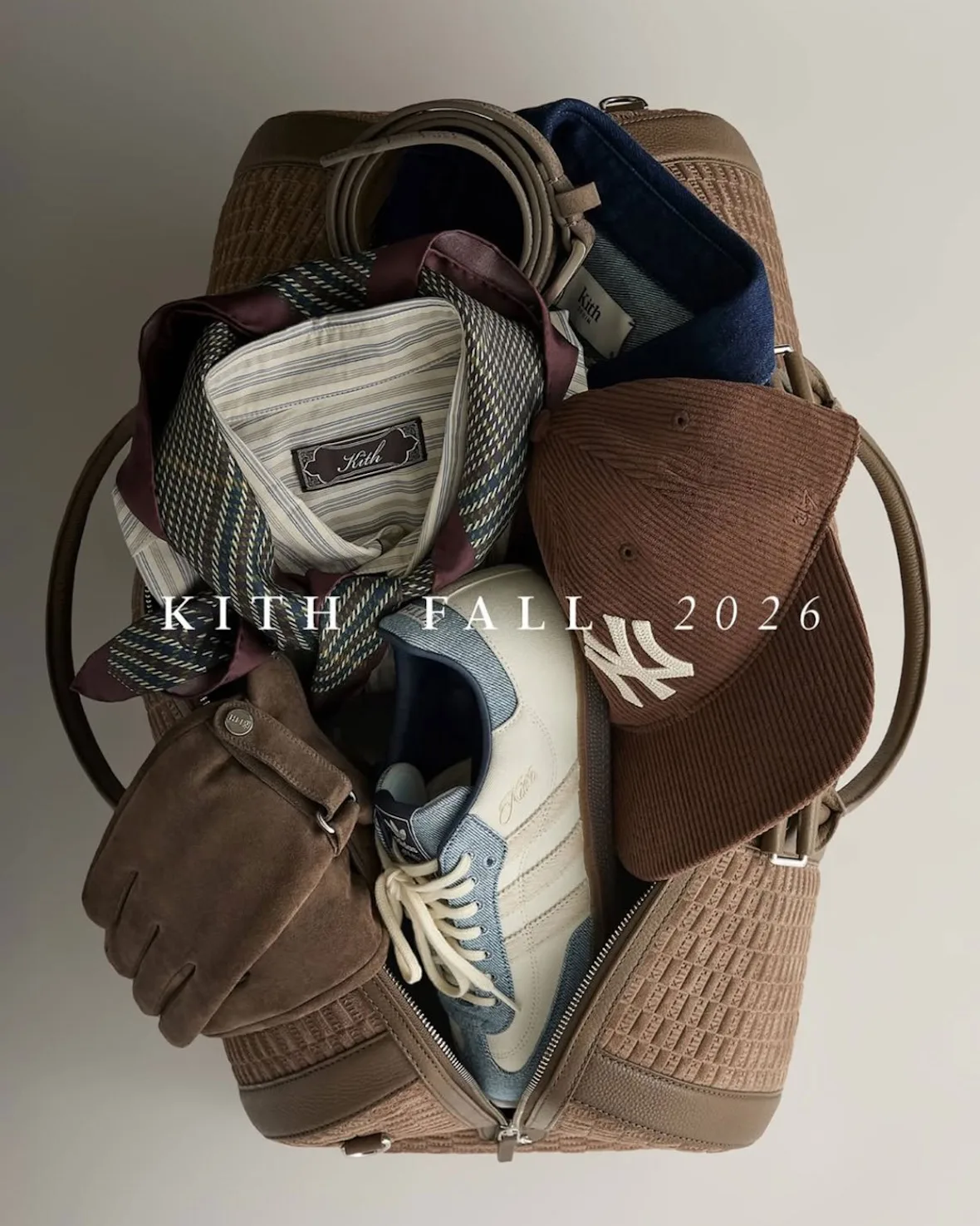 flat lay with duffel bag, cap, gloves and ties, Kith Fall 2026 text, Denim